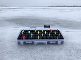 Angled view of FishMore T3 Pro Tackle Box fitting Ice Fishing Jigging Spoons size 1/16 oz to 1/8 oz lures in Plano 3600 size
