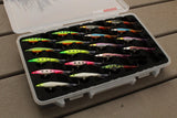 Angled view of FishMore T3 Pro Tackle Box fitting Rapala Jigging Shadow Rap size JSDR09 lures in Plano 3700 size